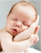 Picture of baby's head in parents hand